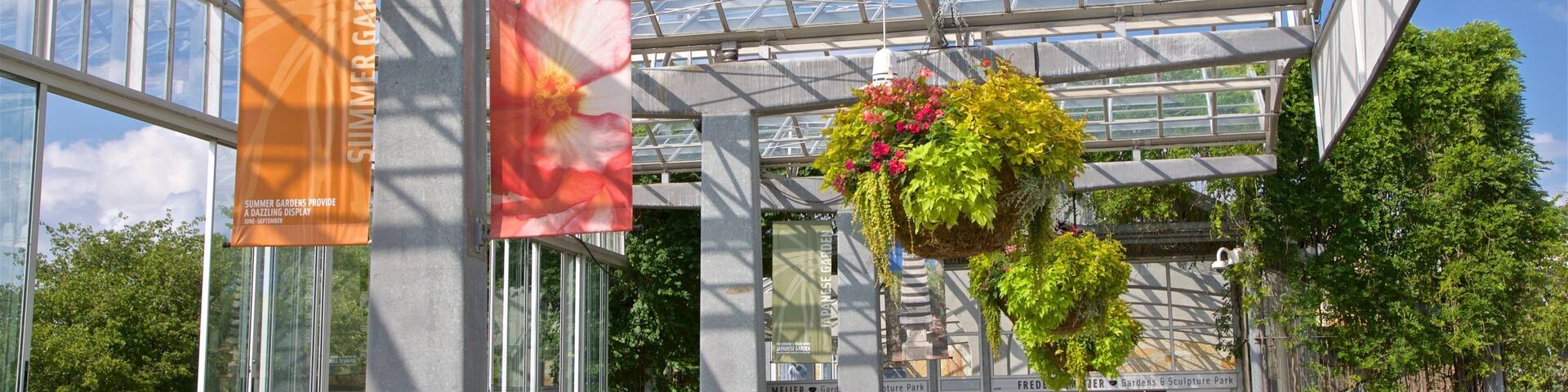 Frederik Meijer Gardens and Sculpture Park featuring flowers and signage