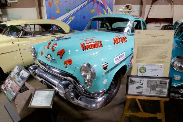 R.E. Olds Transportation Museum which includes interior views, heritage elements and signage