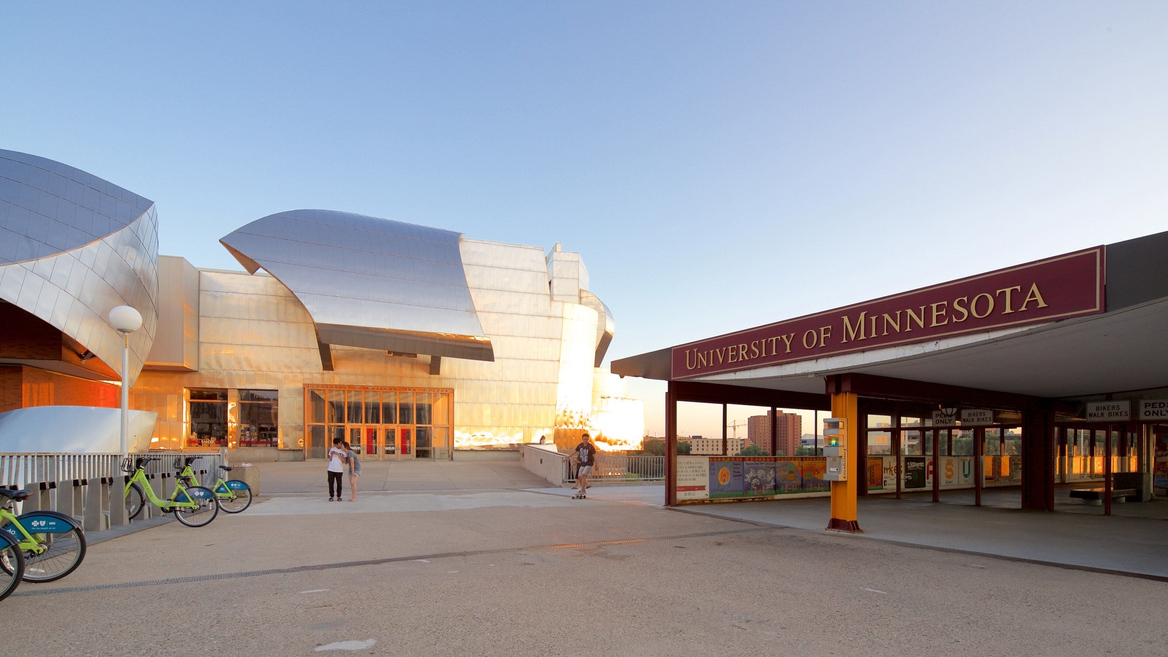 The University of Minnesota campus with modern architecture and a covered entrance area.