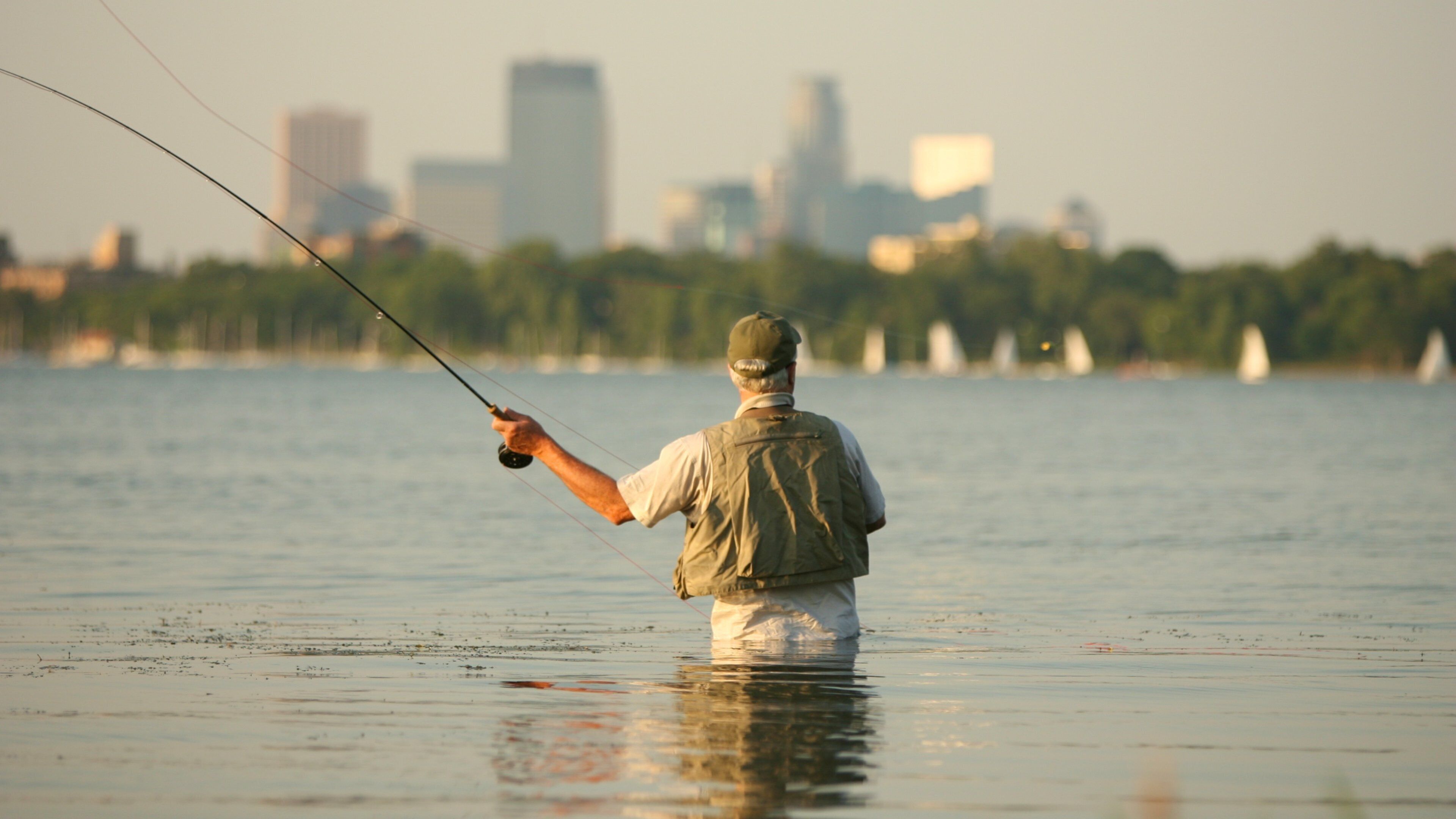Lake Calhoun showing landscape views, fishing and a lake or waterhole