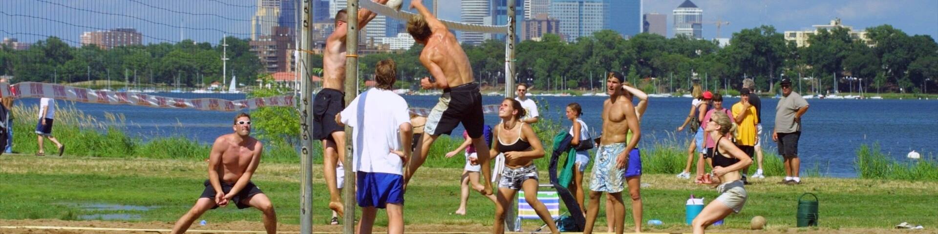 Bde Maka Ska showing a sporting event, a skyscraper and a city