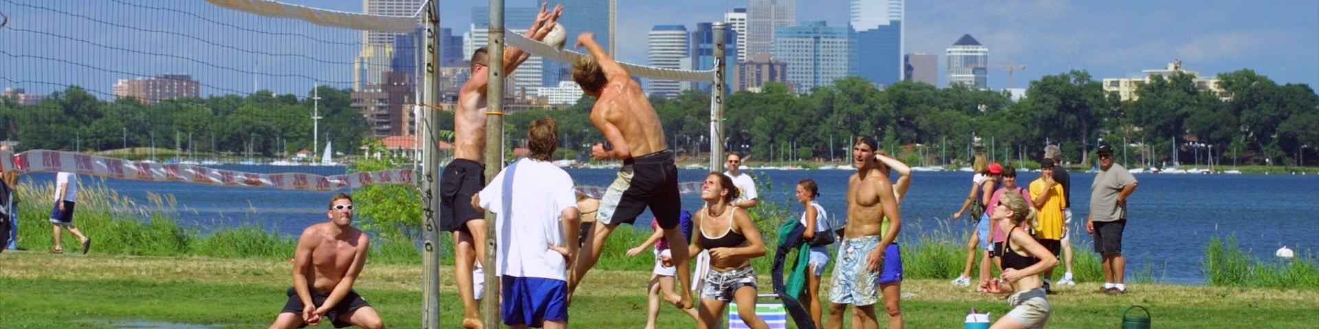 Bde Maka Ska showing a sporting event, a skyscraper and a city