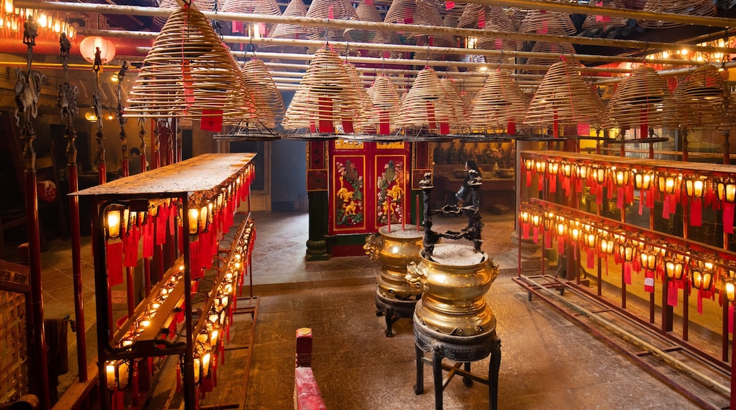 Man Mo Temple which includes a temple or place of worship, interior views and heritage elements