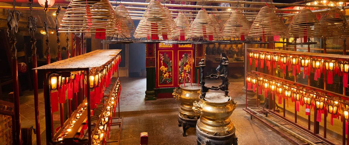 Man Mo Temple which includes a temple or place of worship, interior views and heritage elements