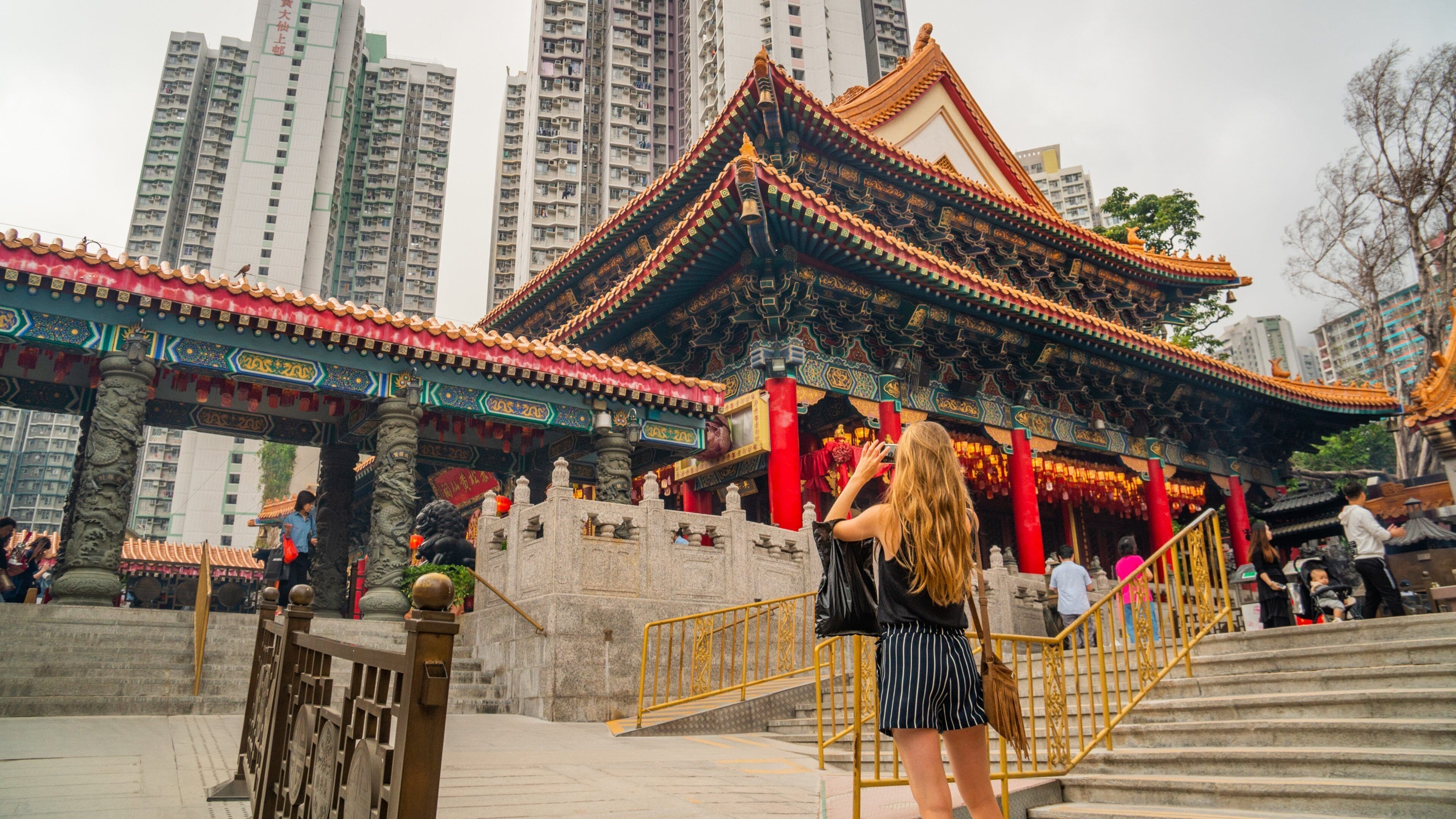 Wong Tai Sin Temple which includes street scenes and heritage elements as well as an individual femail