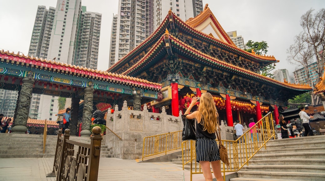 Wong Tai Sin Temple which includes street scenes and heritage elements as well as an individual femail