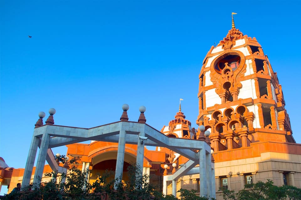 A large temple with intricate architecture and a clear blue sky.