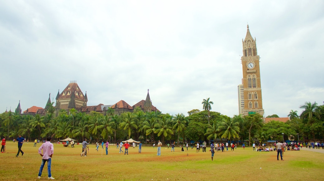 Rajabai Tower showing a park as well as a large group of people
