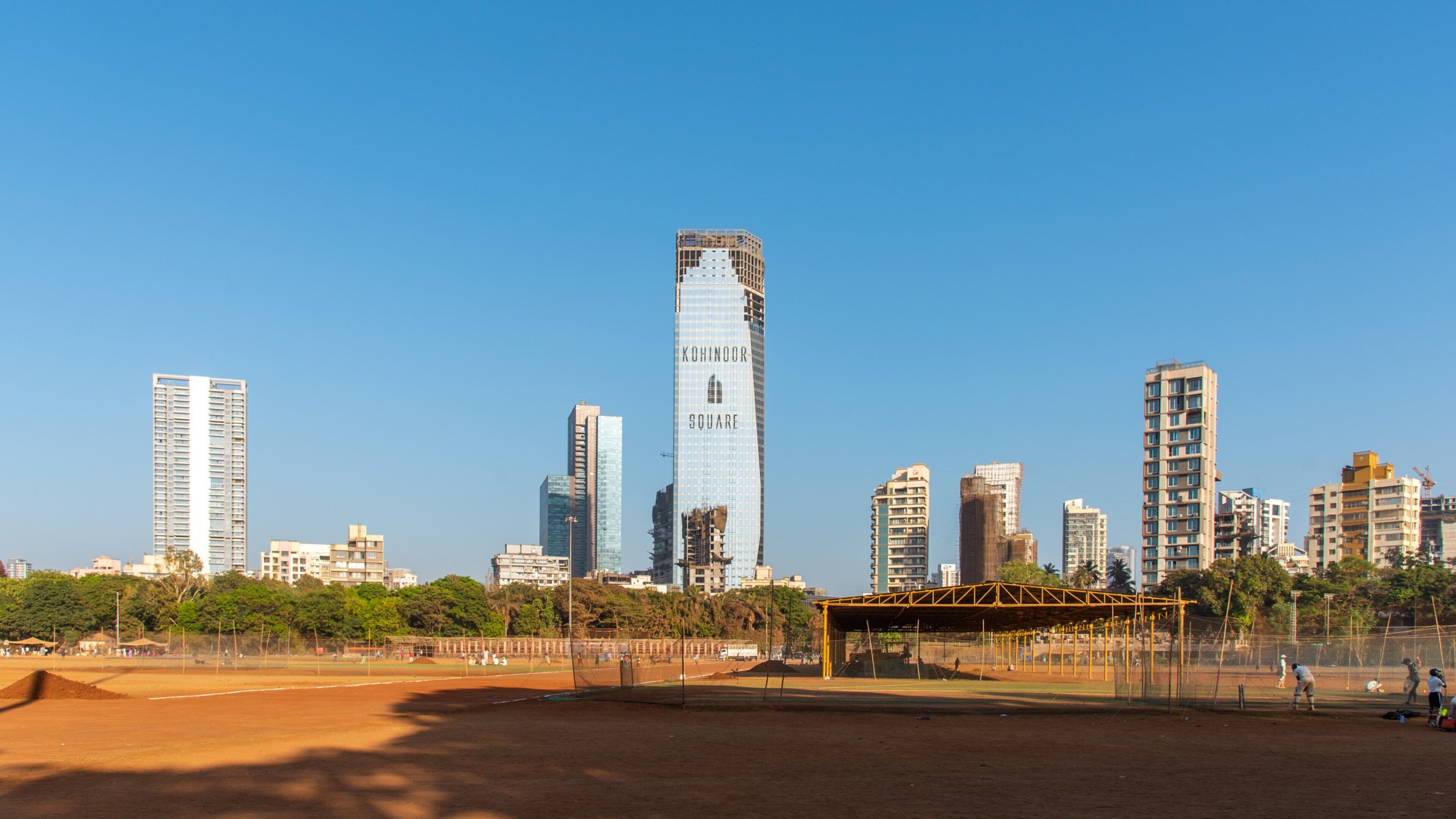 Shivaji Park which includes a high rise building and a sporting event