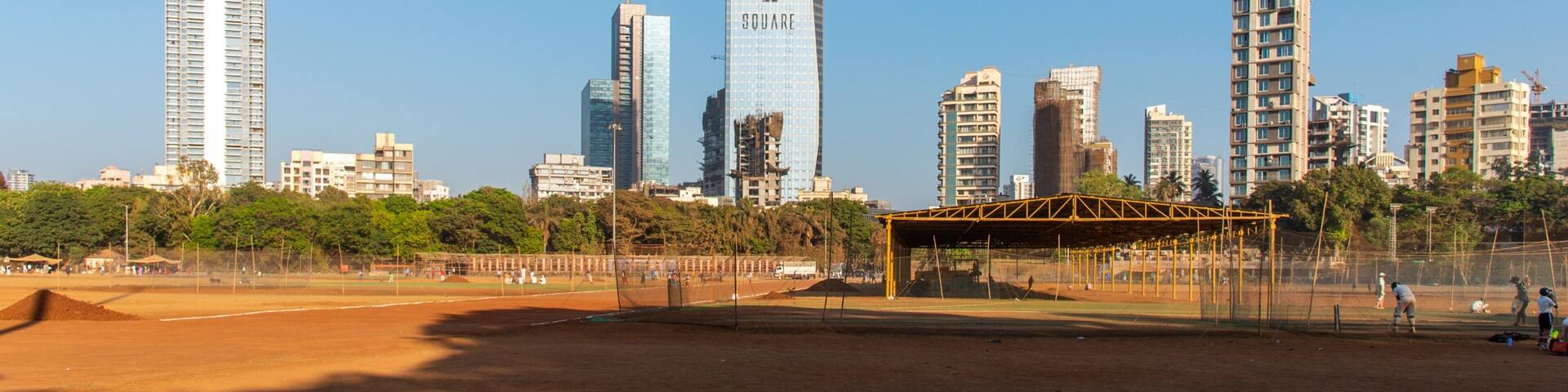 Shivaji Park which includes a high rise building and a sporting event