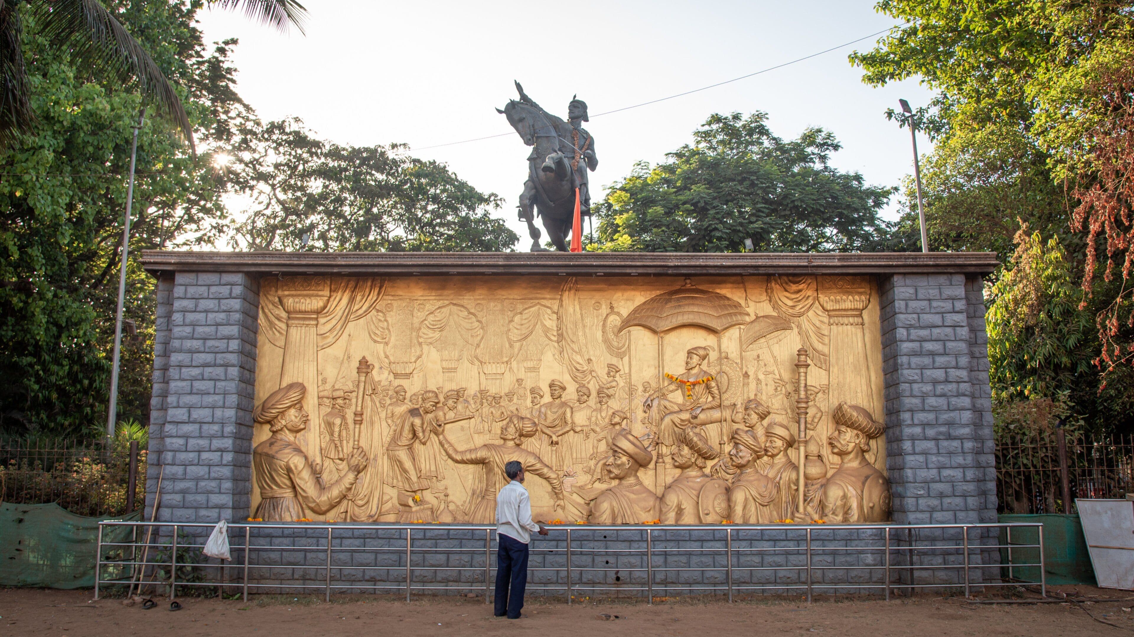 Shivaji Park which includes heritage elements and a statue or sculpture as well as an individual male