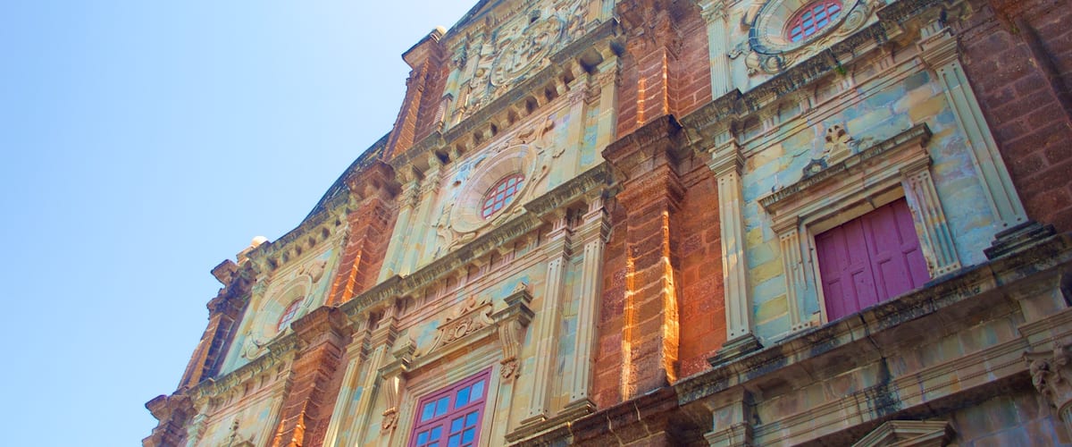 A historic building with ornate architectural details, including a clock and decorative windows.