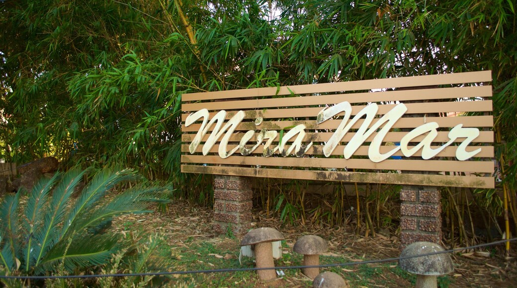Miramar Beach featuring forests and signage