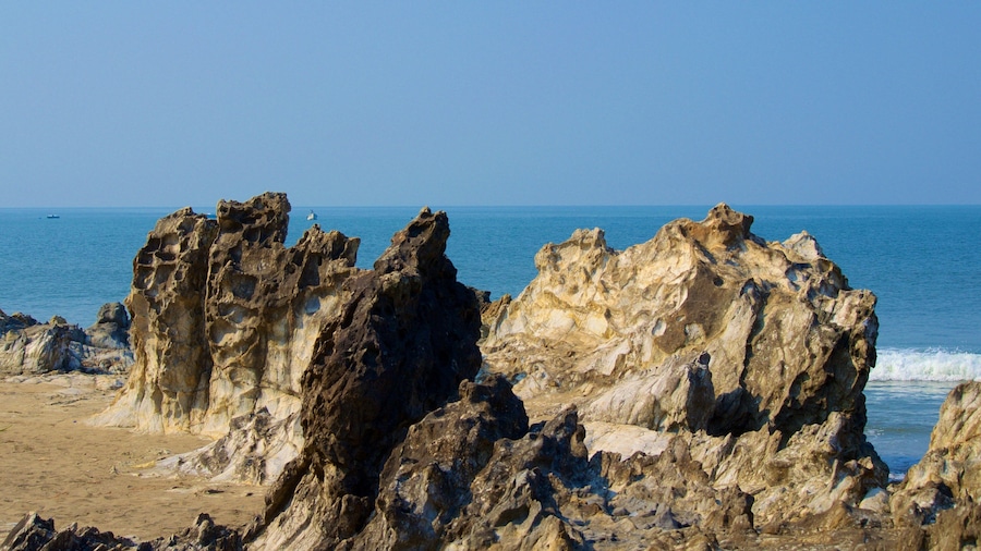 Vagator Beach featuring rugged coastline and general coastal views