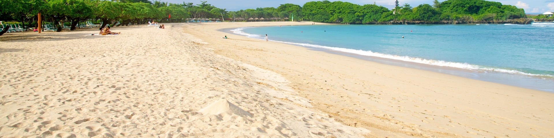 Nusa Dua Beach which includes a sandy beach and tropical scenes