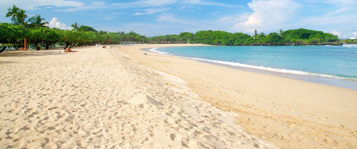 Nusa Dua Beach which includes a sandy beach and tropical scenes