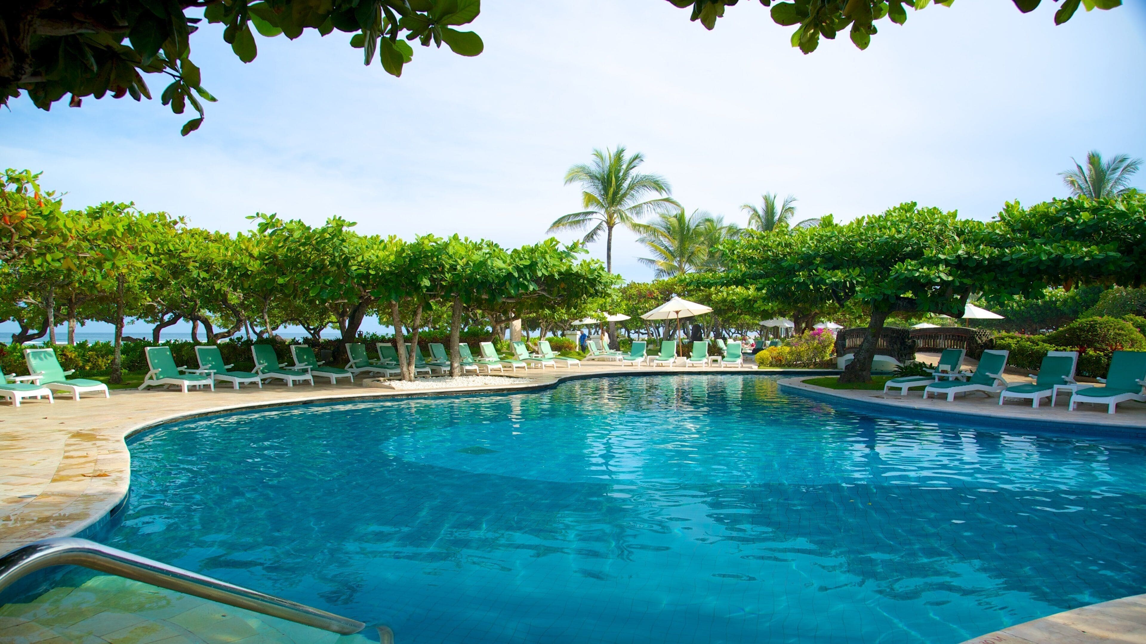 Nusa Dua Beach showing a pool, tropical scenes and a luxury hotel or resort