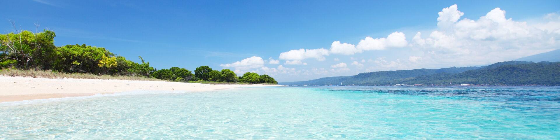 Sandy coast and clear sea of the Bali Barat National Park. Java island on the horizon (right); Shutterstock ID 100213352; Purchase Order: -