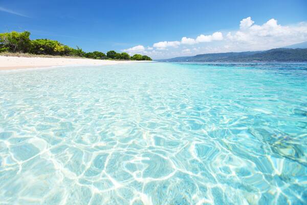 Sandy coast and clear sea of the Bali Barat National Park. Java island on the horizon (right); Shutterstock ID 100213352; Purchase Order: -