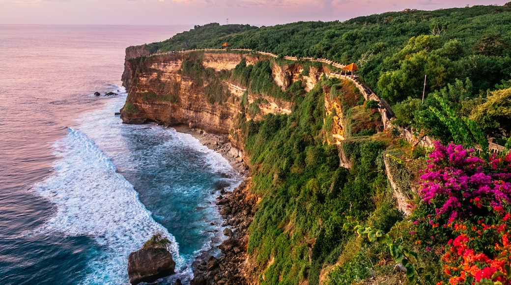 Scenic landscape of high cliff with fantastic sunset sky at Uluwatu . Travel Bali, Indonesia