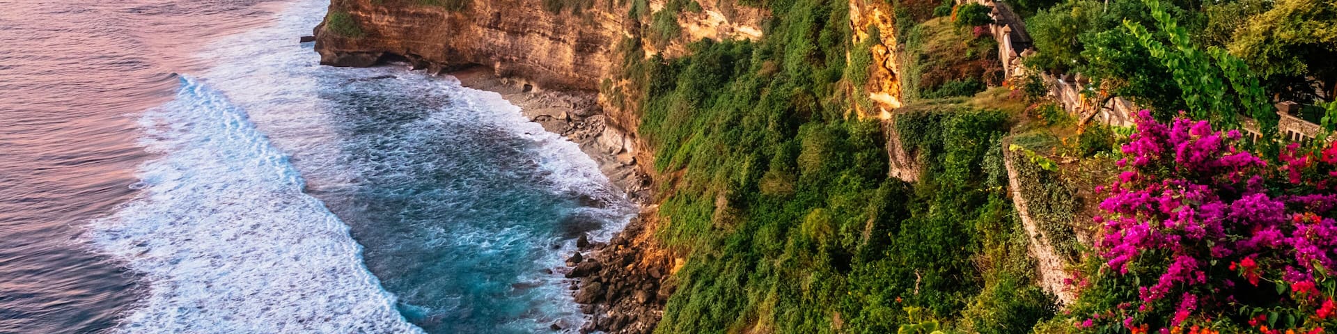 Scenic landscape of high cliff with fantastic sunset sky at Uluwatu . Travel Bali, Indonesia