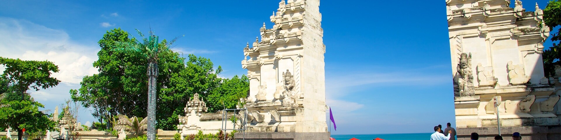Kuta Beach which includes street scenes and general coastal views