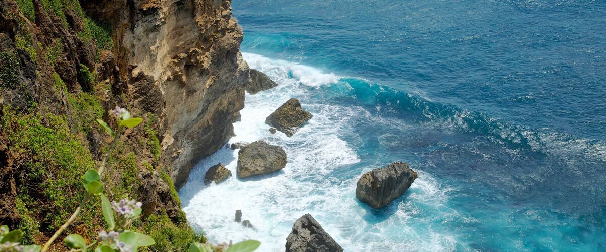 Uluwatu Temple featuring rugged coastline
