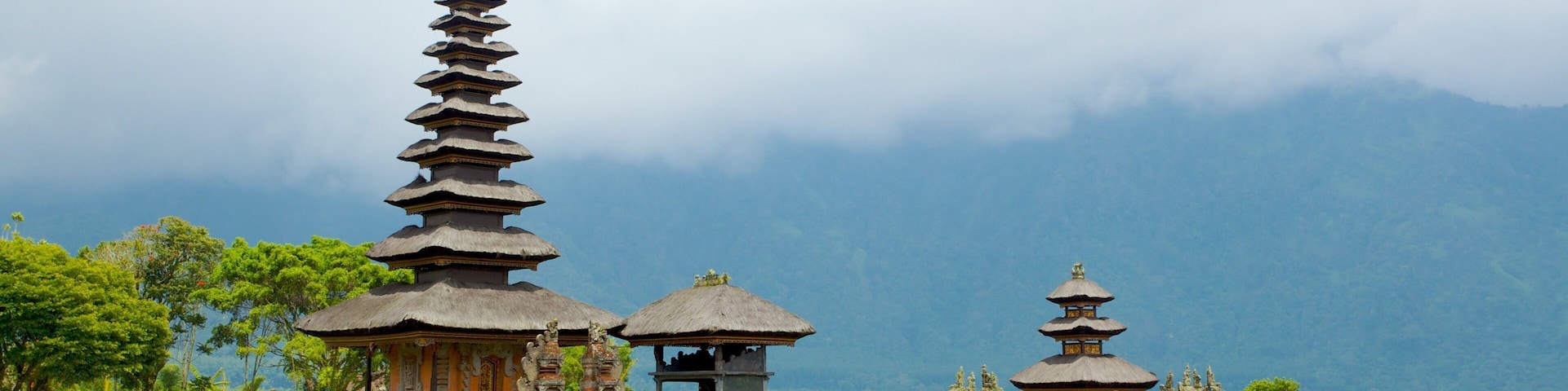 Ulun Danu Temple which includes general coastal views, religious elements and a temple or place of worship