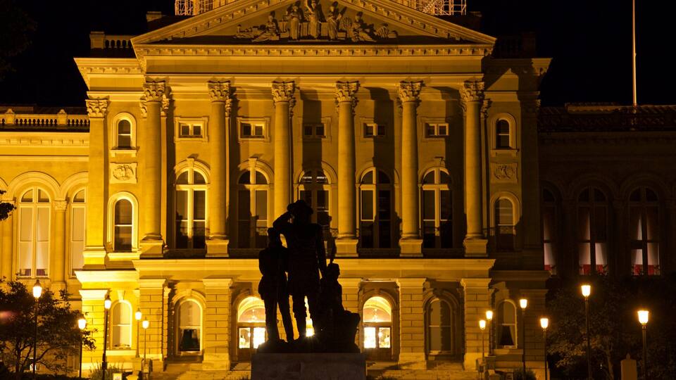 Iowa State Capitol Building which includes night scenes, heritage architecture and a statue or sculpture