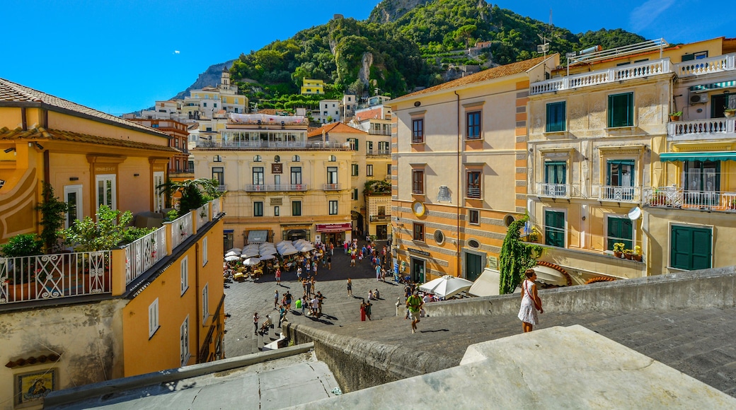 JM7FKR Mountain and city from the top of the stairs of the Amalfi Cathedral on the Amalfi Coast of Italy on a warm and clear summer day