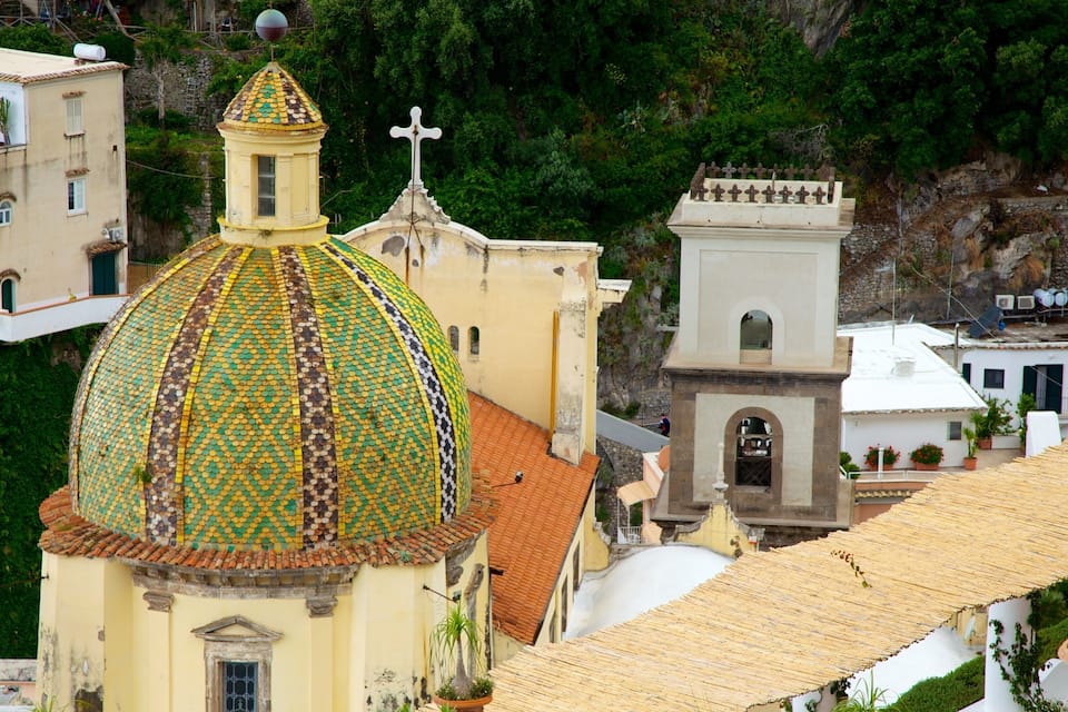 A church with a colorful dome and a bell tower.