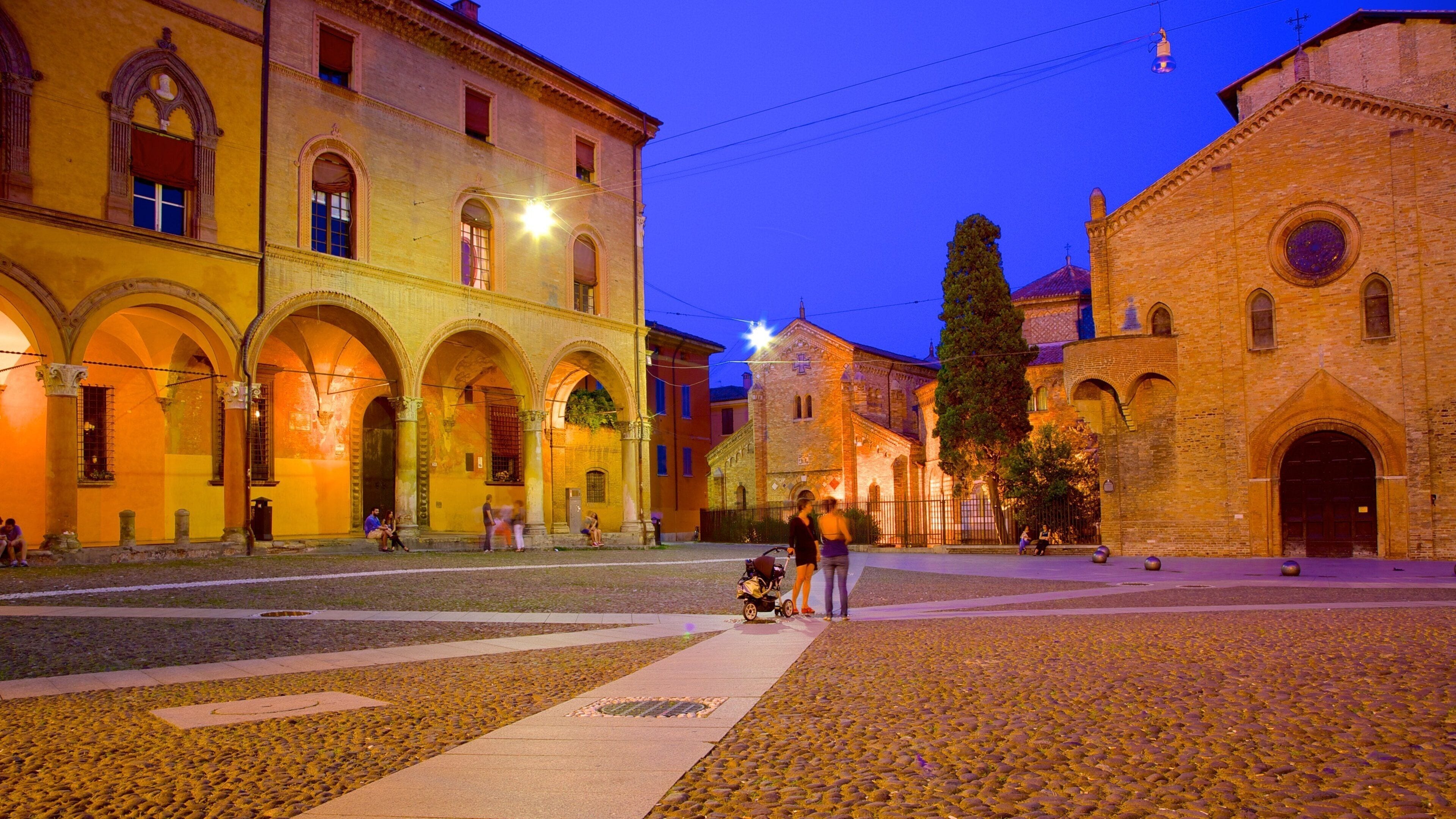 Basilica Santo Stefano showing night scenes, a square or plaza and a church or cathedral