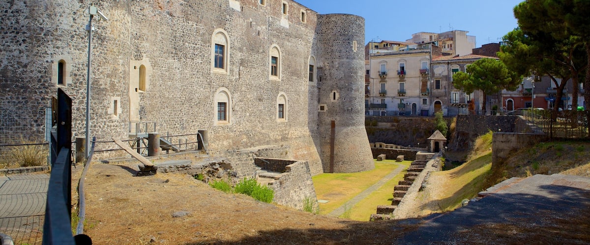 A historic stone fortress with arched windows and a central tower.
