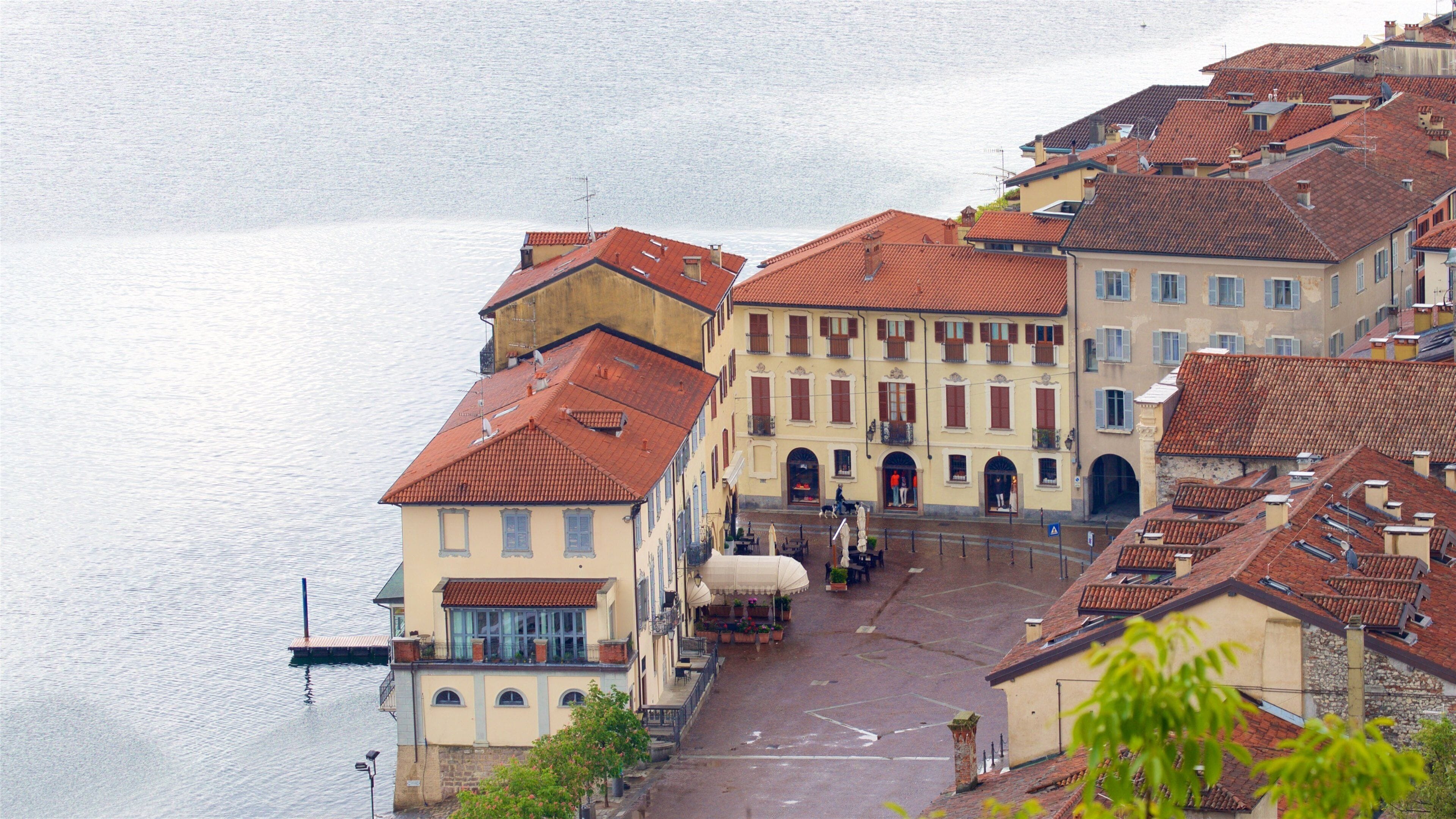 Angera featuring a lake or waterhole and a small town or village