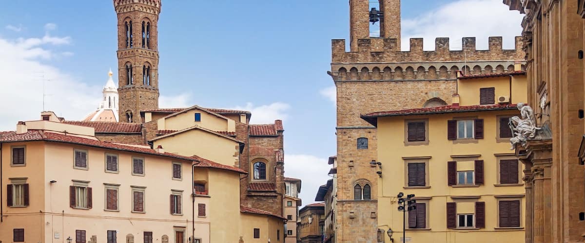 towers Badia Fiorentina and bargello over houses; Shutterstock ID 1075477115