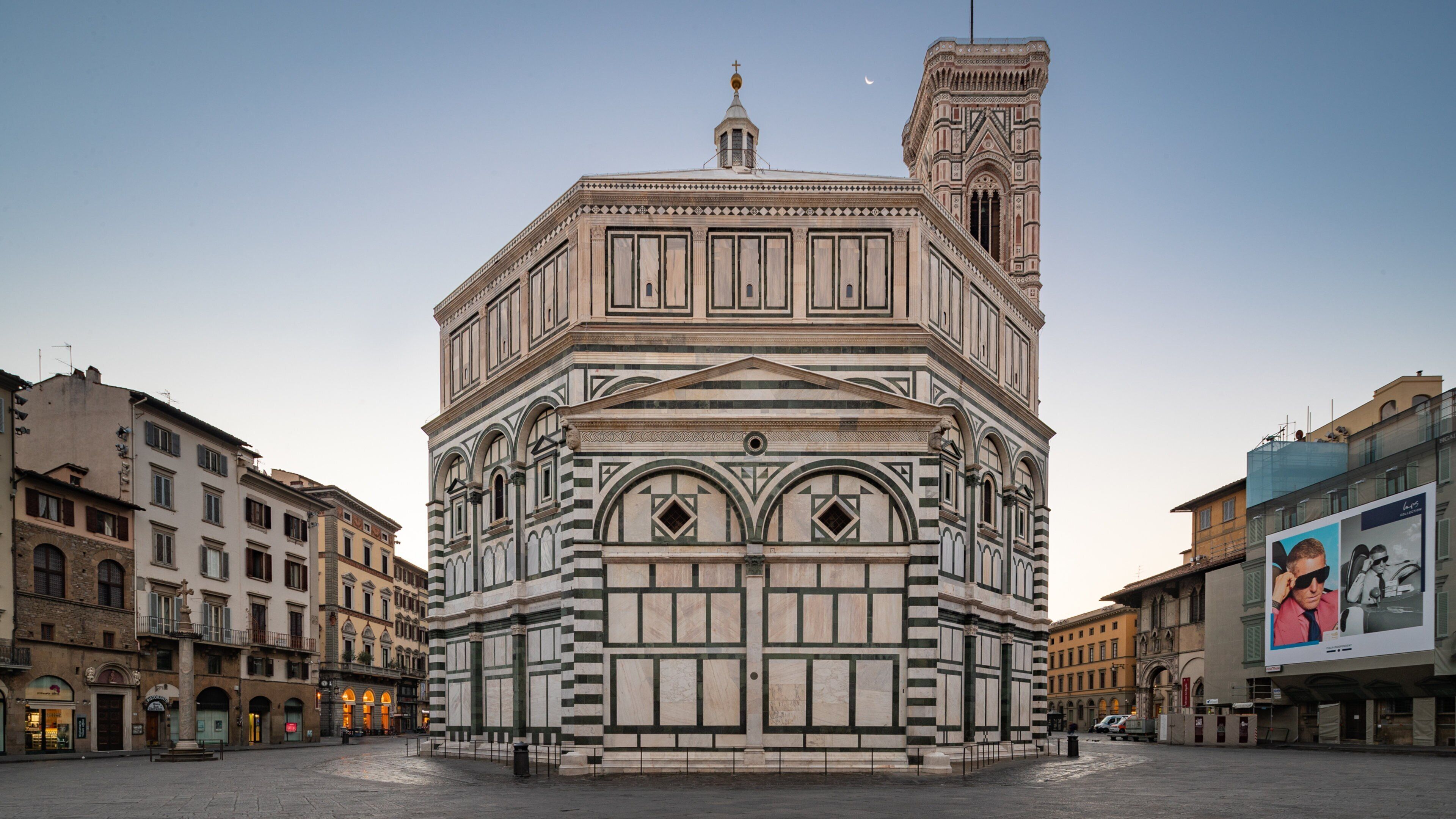 Florence Baptistery featuring heritage architecture and a sunset