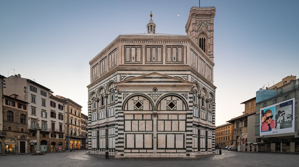 Florence Baptistery featuring heritage architecture and a sunset