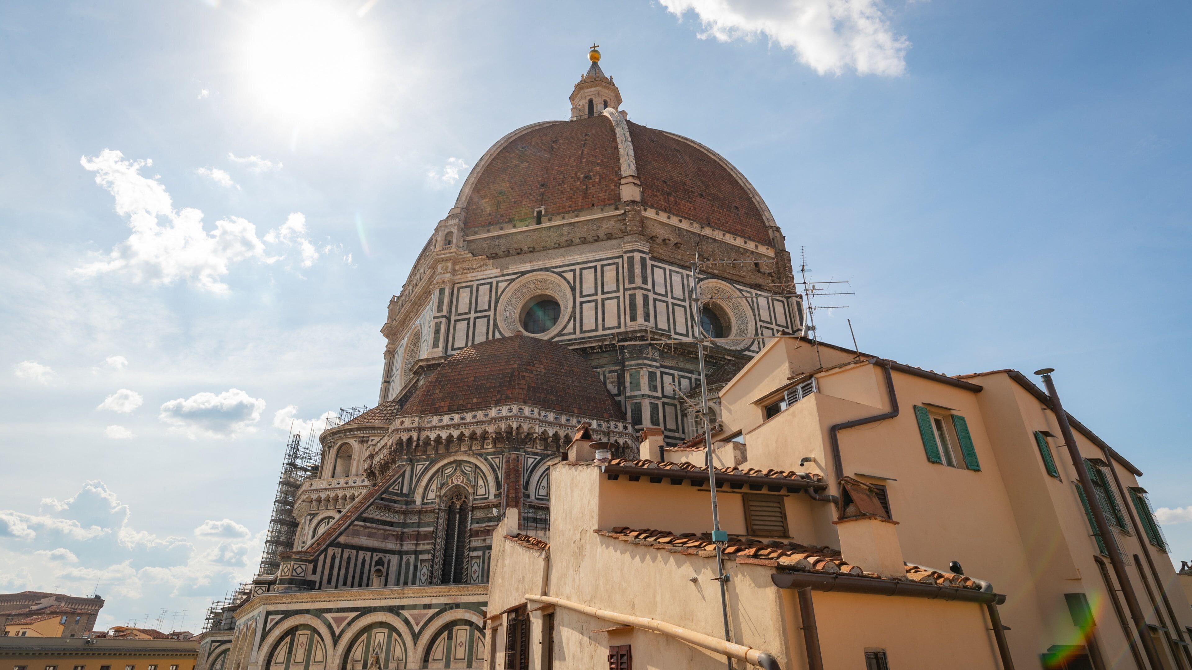 A historic building with a large dome and intricate architectural details.