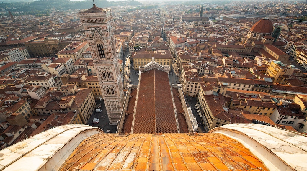Giotto\'s Campanile which includes landscape views and a city