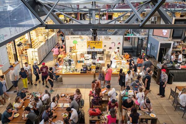 Central Market featuring interior views and dining out as well as a large group of people