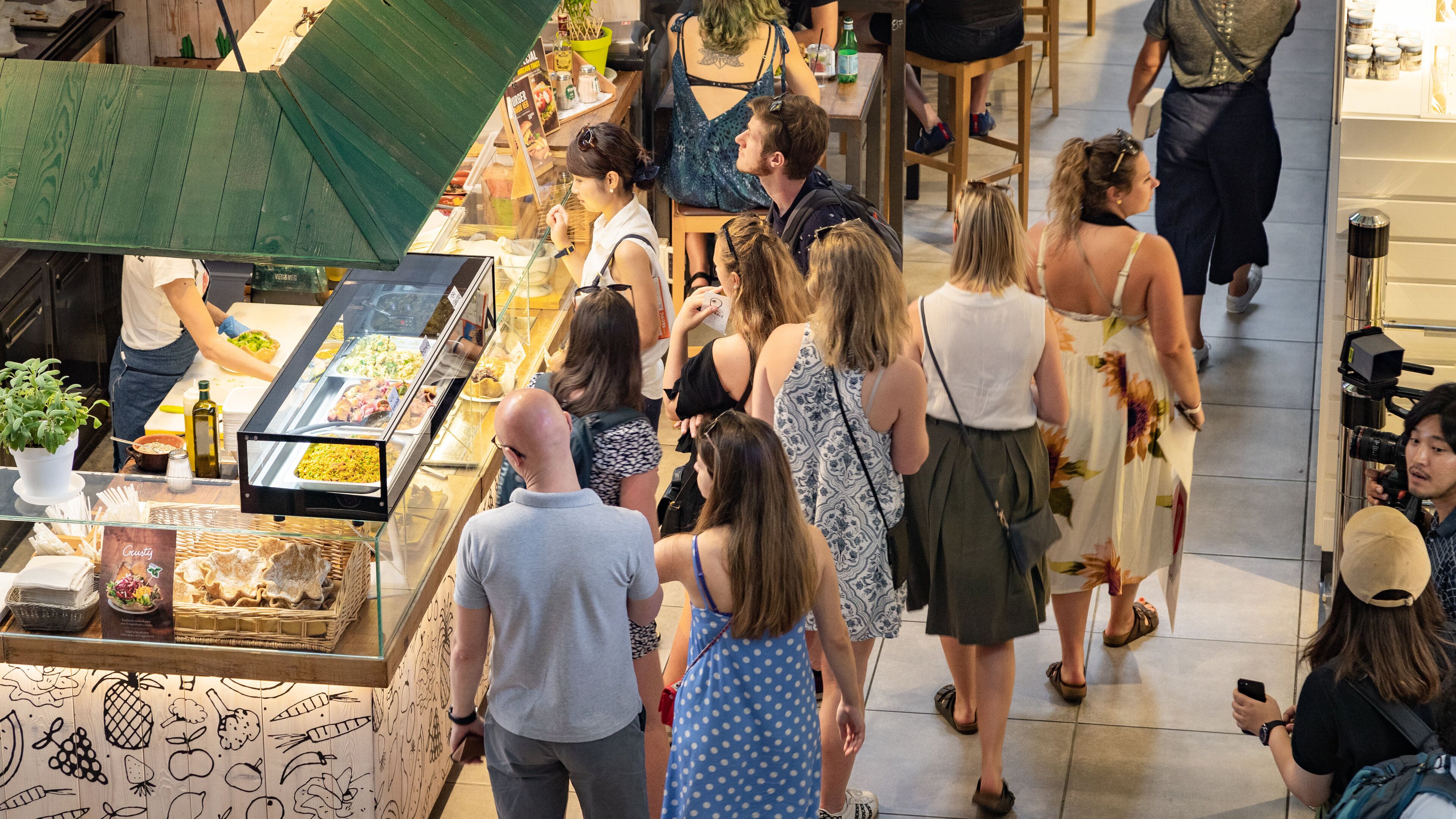 Central Market showing cafe scenes and interior views as well as a small group of people