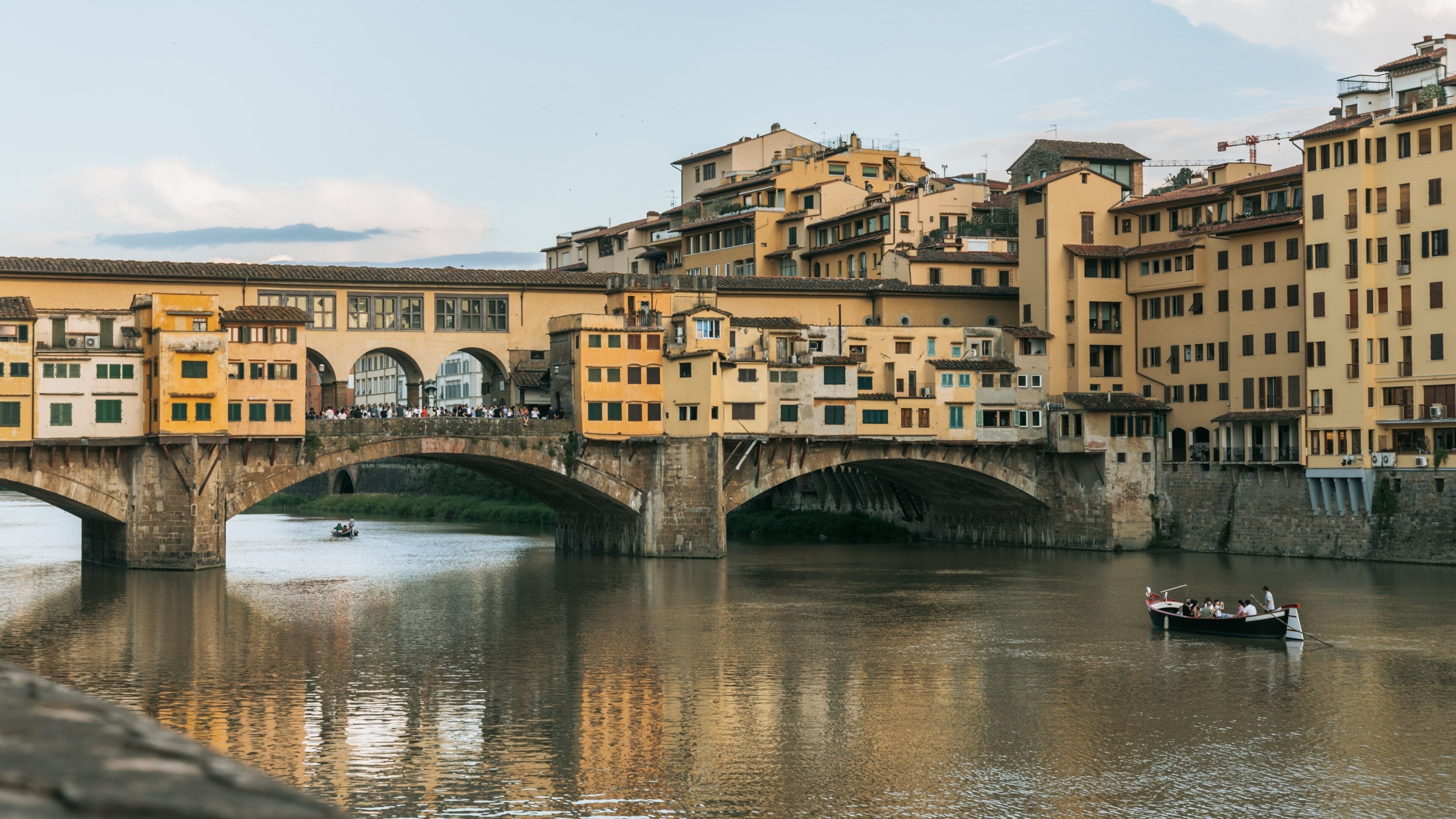 Ponte Vecchio showing a bridge, boating and a river or creek