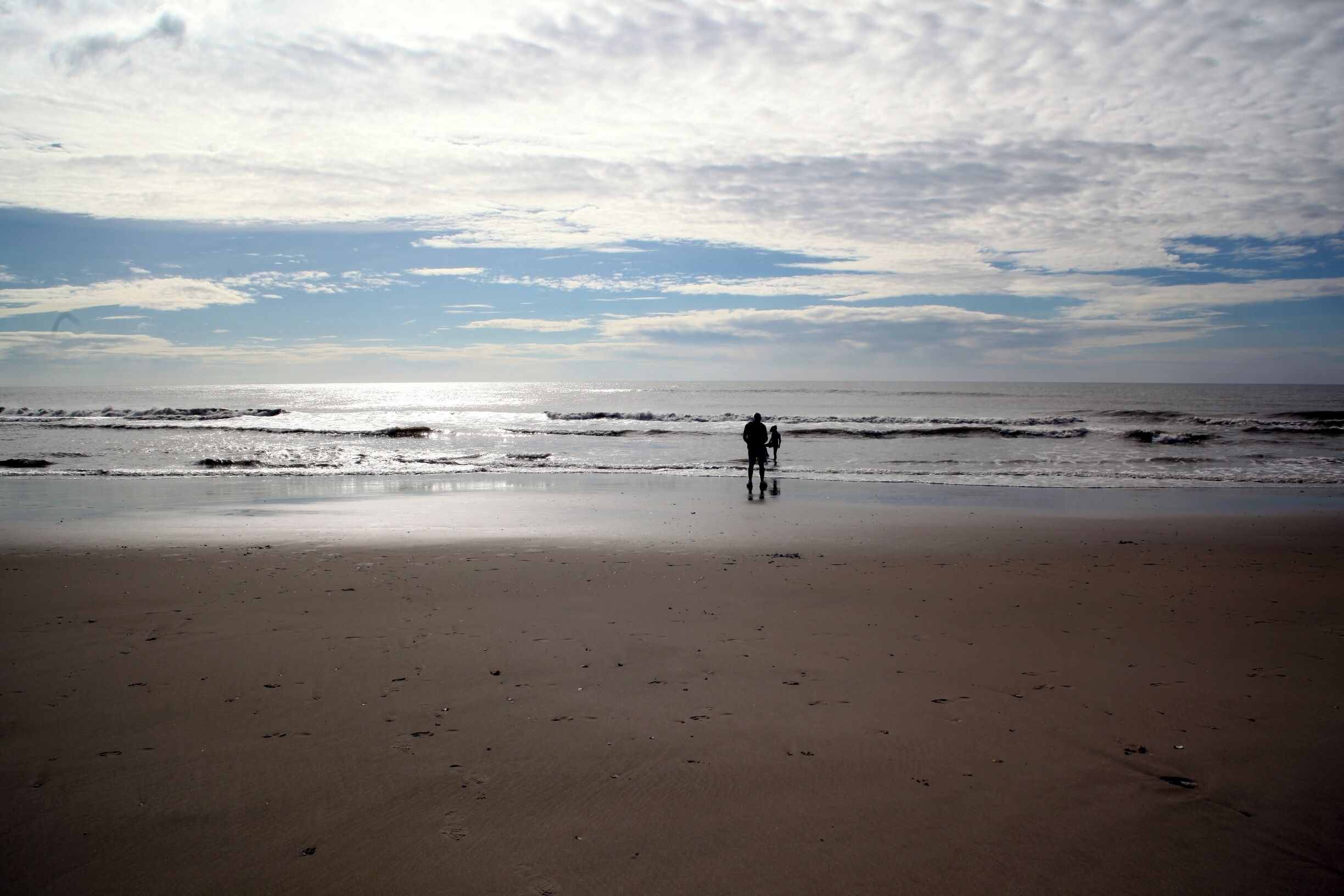 Mid-week morning on the beach is not completely alone, but you have enough space to call your own.  A short walk or bike ride will get you away from the crowds.