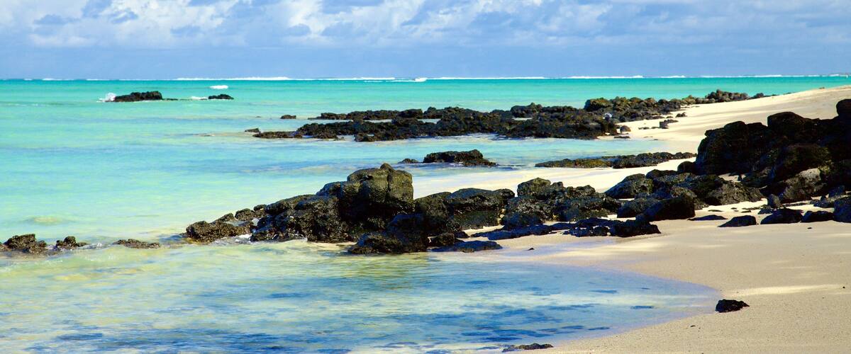 Ile aux Cerfs Beach which includes general coastal views and rocky coastline