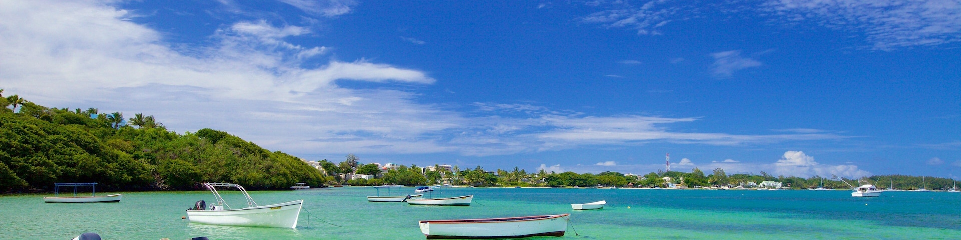 Ile aux Cerfs Beach showing a bay or harbor, boating and general coastal views