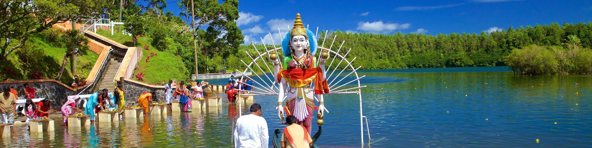 Ganga Talao featuring religious elements, a statue or sculpture and a lake or waterhole