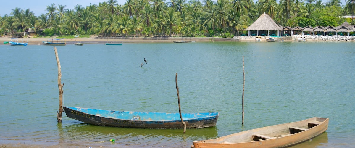 Playa de Barra Vieja showing kayaking or canoeing, a sandy beach and tropical scenes
