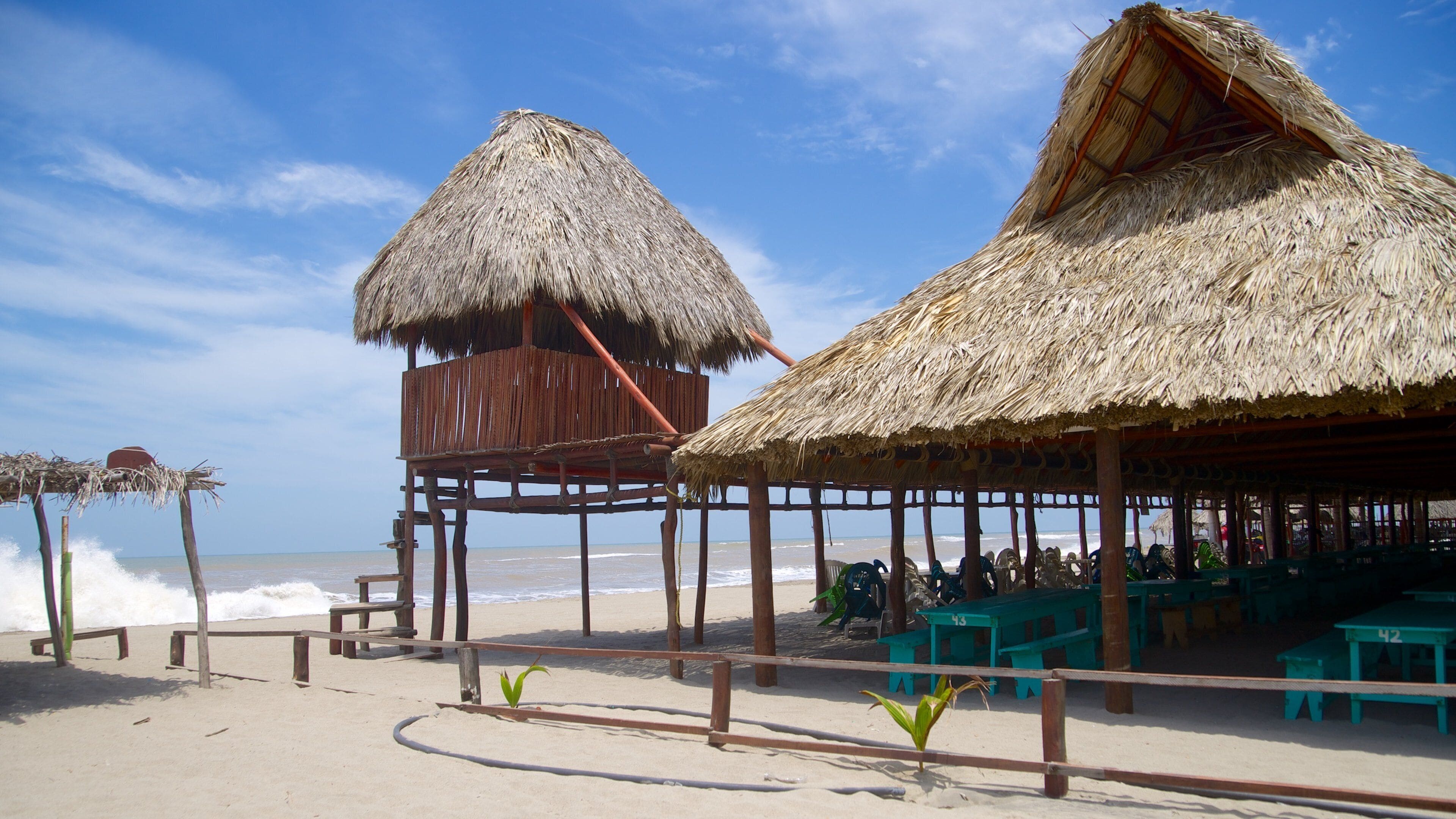 Playa de Barra Vieja showing a beach and a coastal town