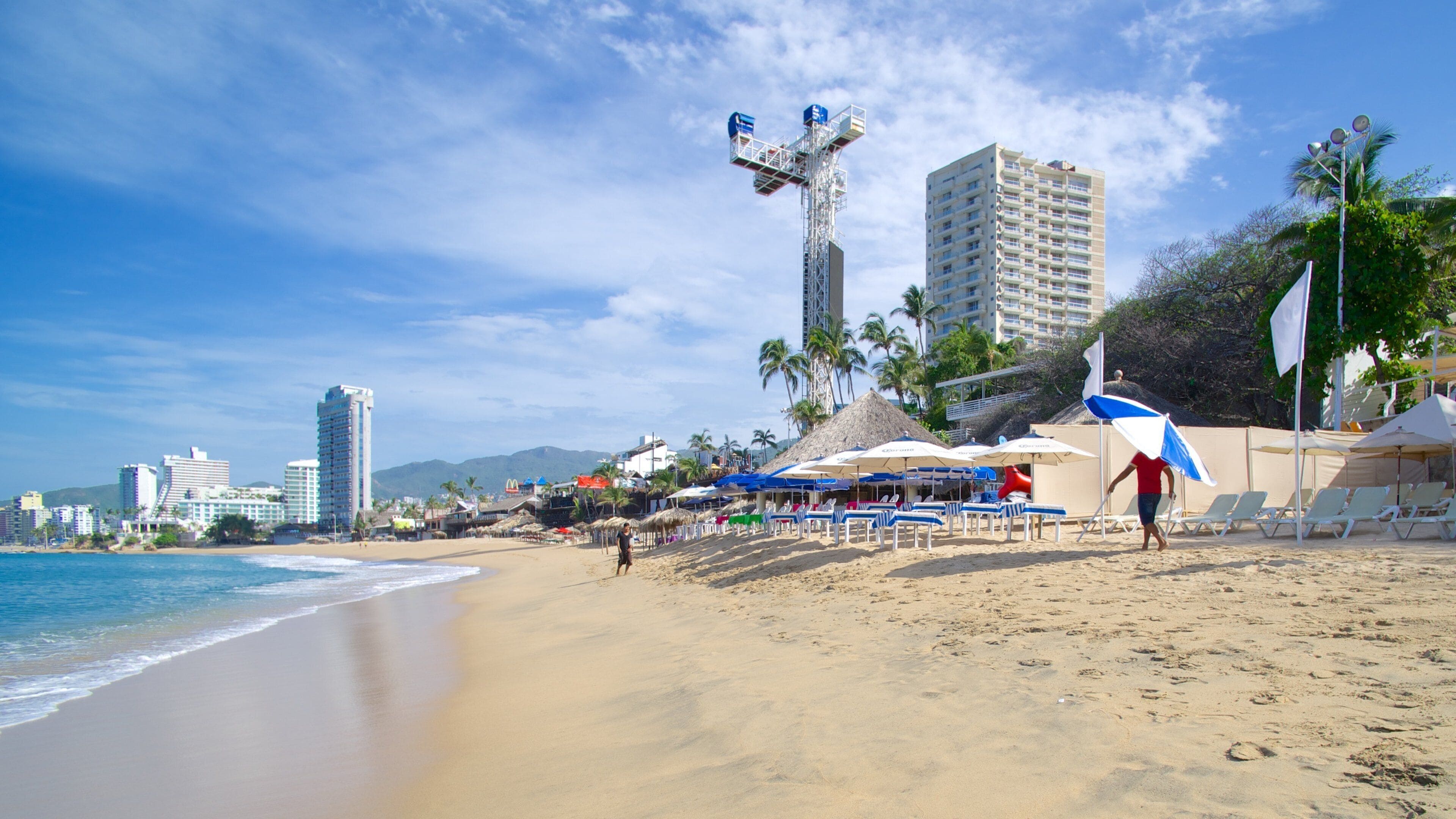 Condesa Beach showing a beach and a coastal town