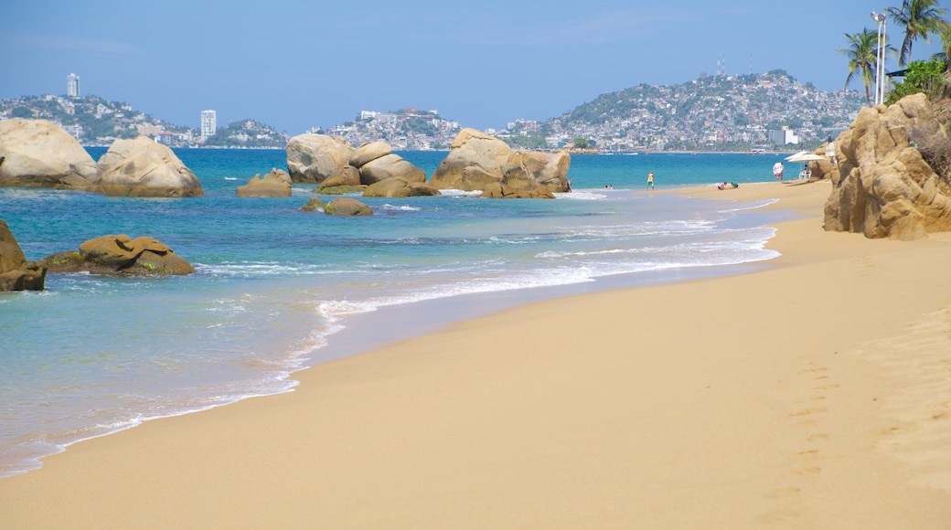 Condesa Beach featuring a coastal town and a beach